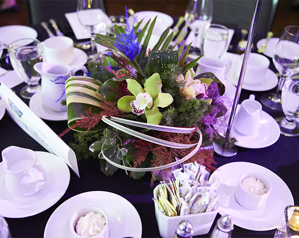 Banquet style linen table with floral centrepiece