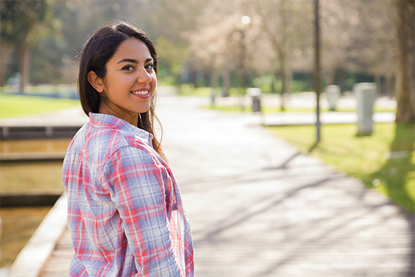 Girl enjoying nature-filled walking trail