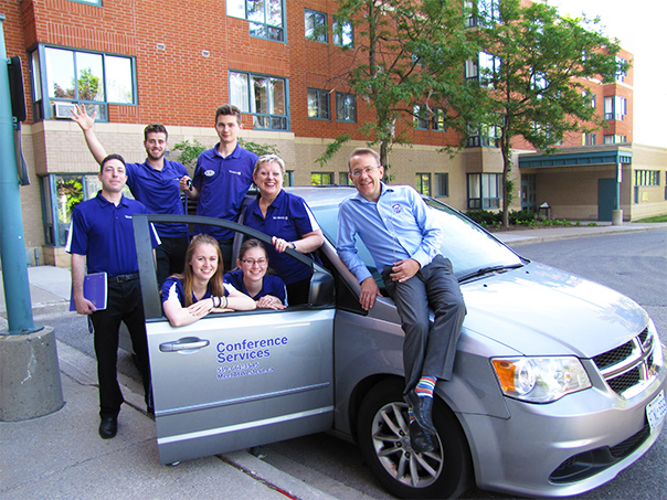 Conference Services team around team vehicle